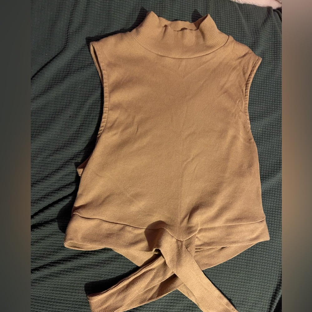 A turtle neck crossed bottom crop top in the shade brown <3